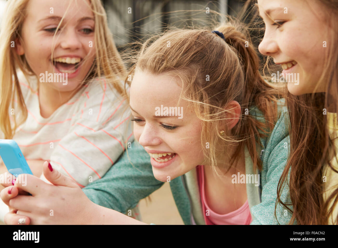 Three girls laughing hi-res stock photography and images - Alamy