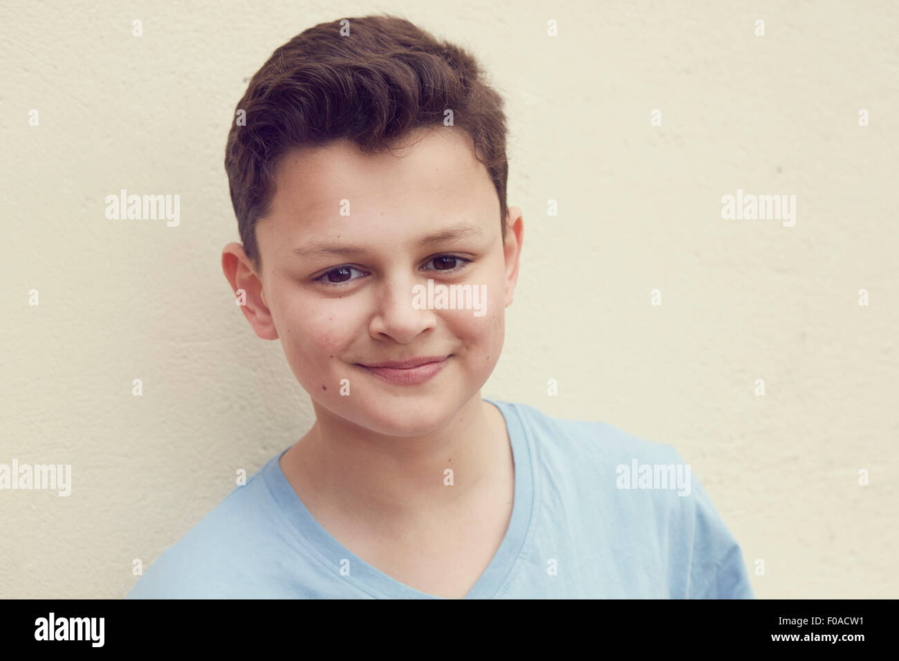 Portrait of boy in front of wall Stock Photo
