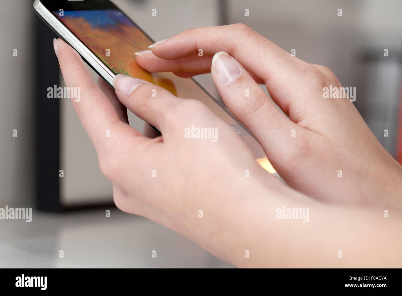 Female hands using smartphone Stock Photo