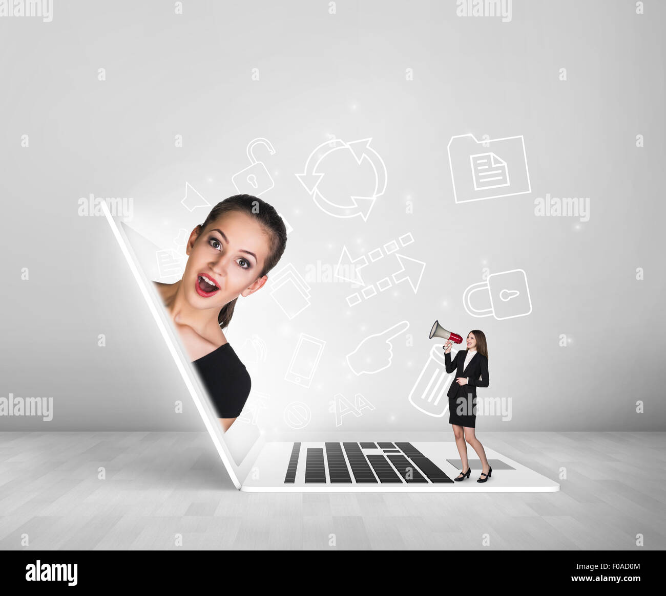 A gorgeous businesswoman looks out of the laptop Stock Photo