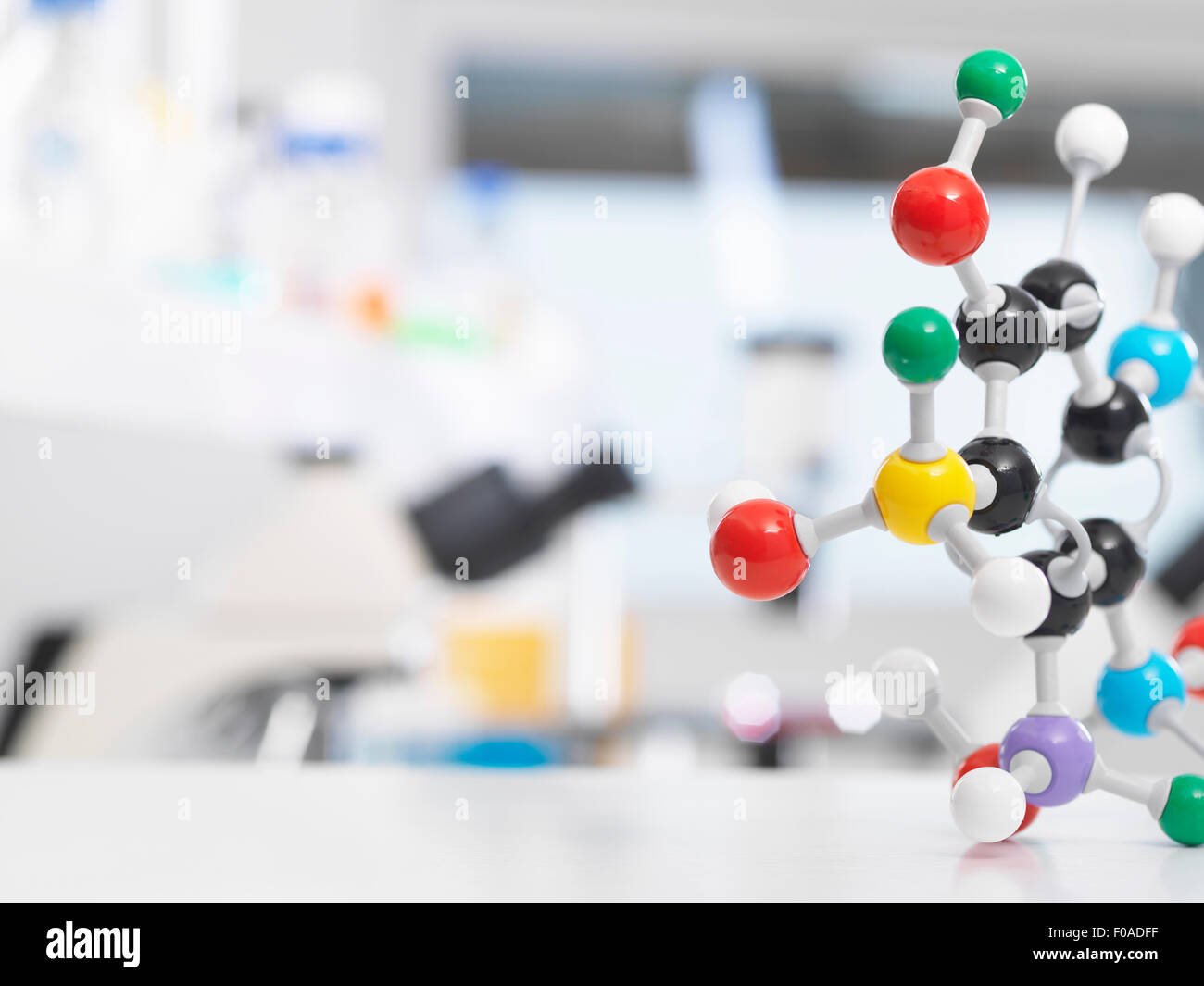Molecular model structure sitting on a lab bench during a experiment. Stock Photo