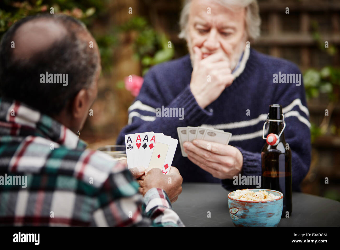 Two senior men playing cards Stock Photo