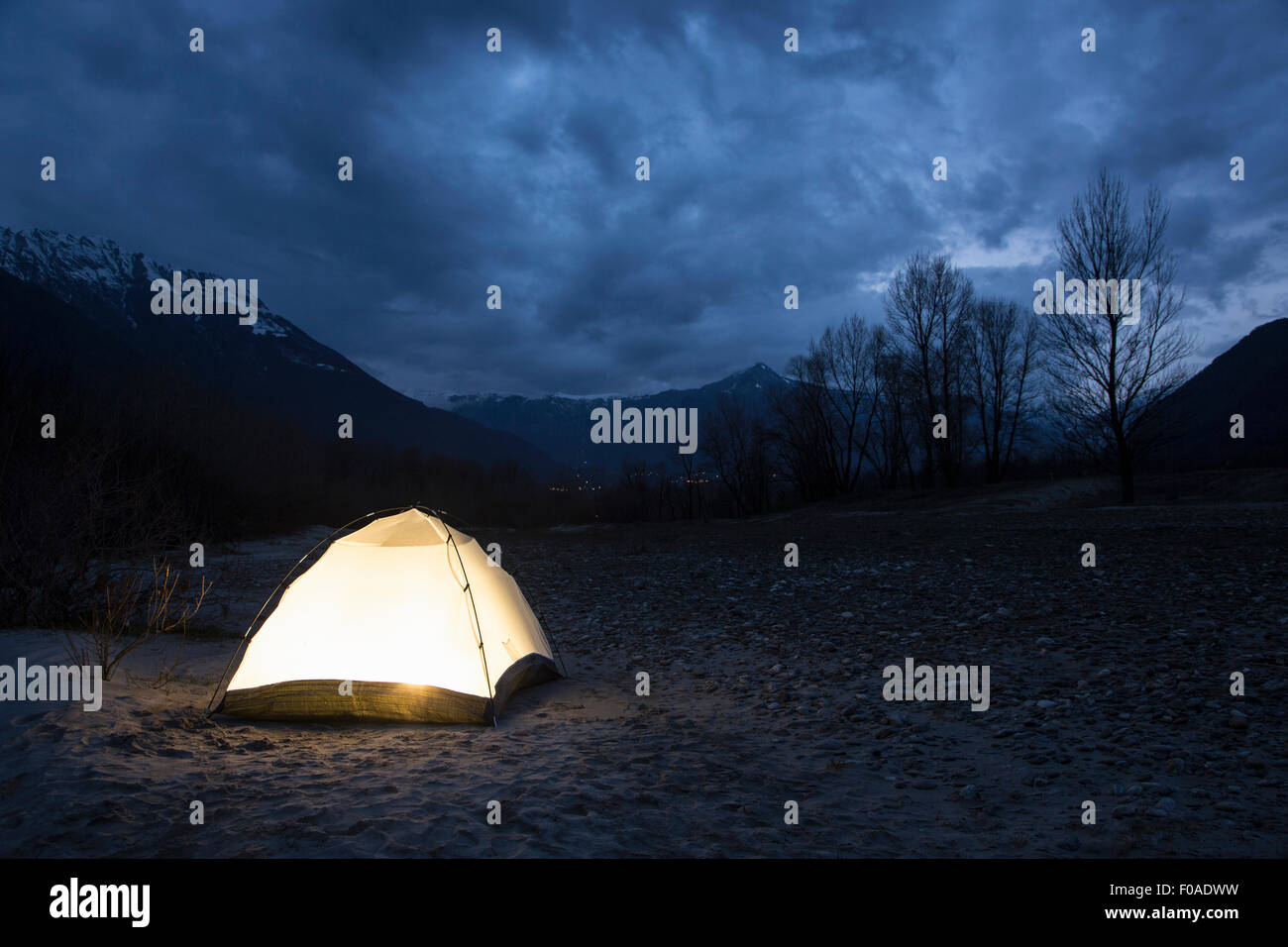 Tent illuminated at night, Premosello, Verbania, Piedmonte, Italy Stock Photo