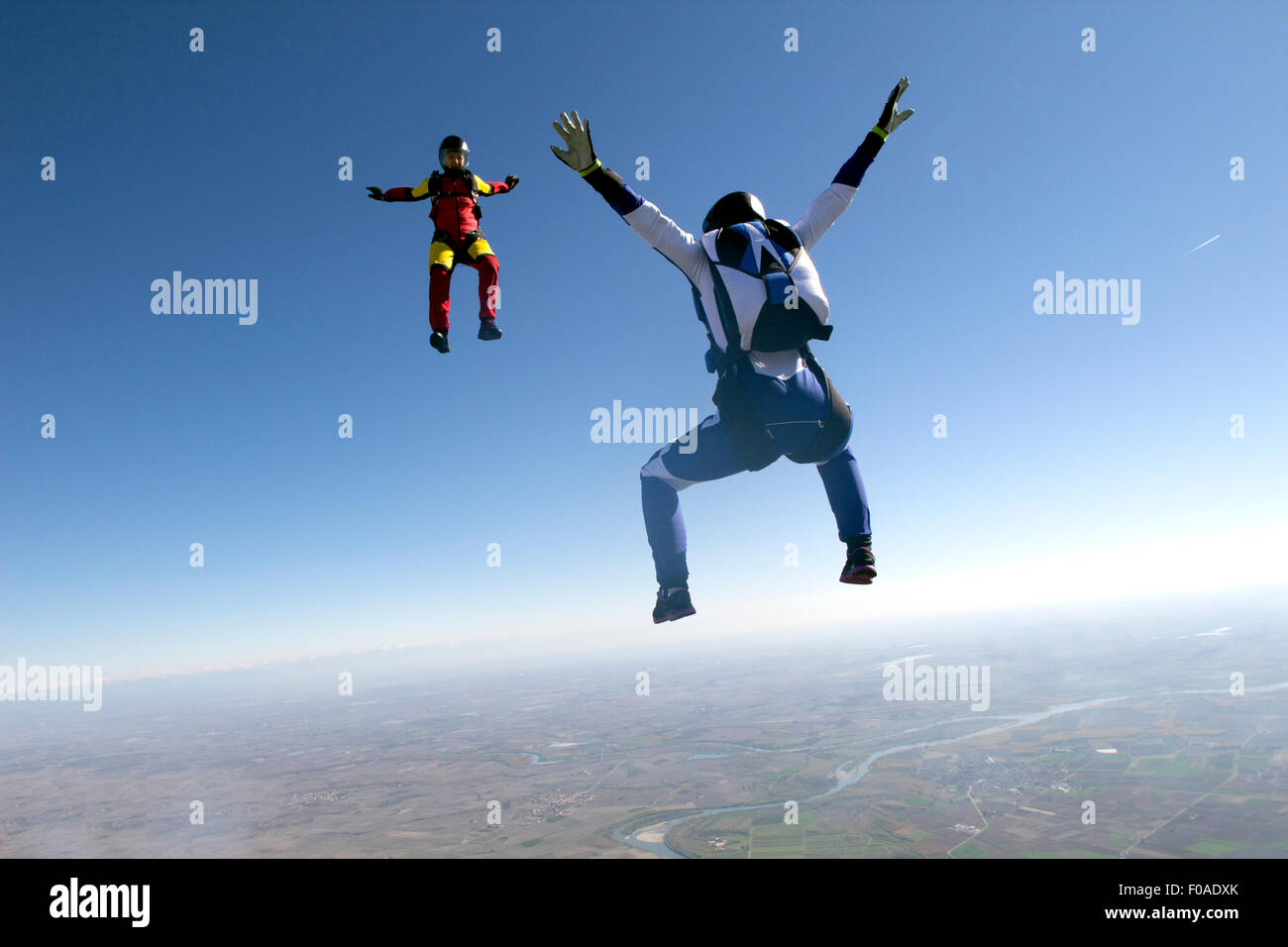 Freeflying skydivers in blue sky Stock Photo