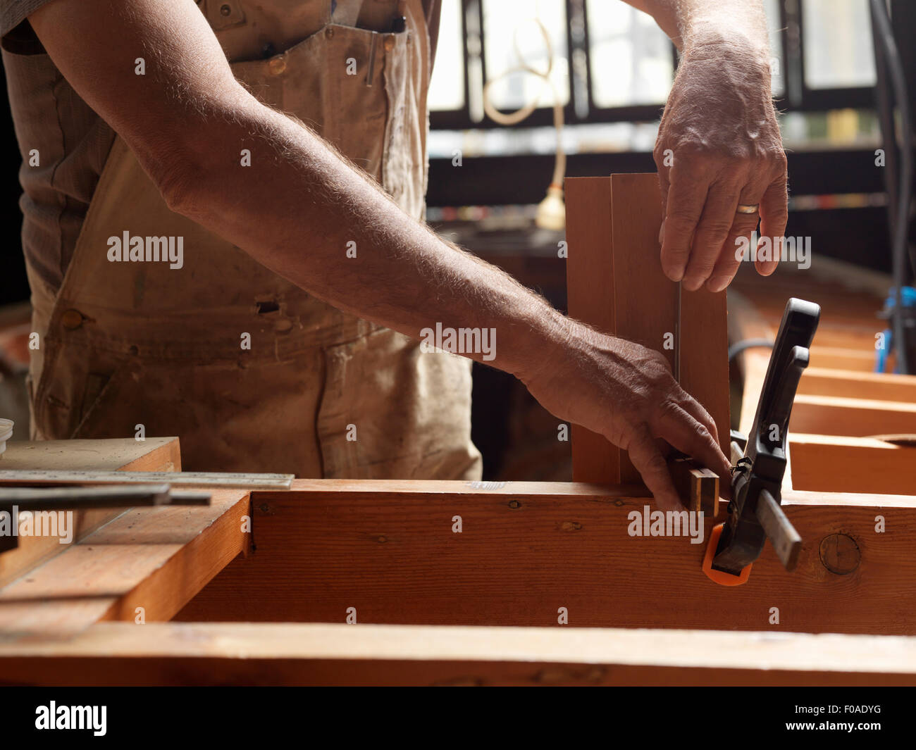 Boat builder in workshop Stock Photo