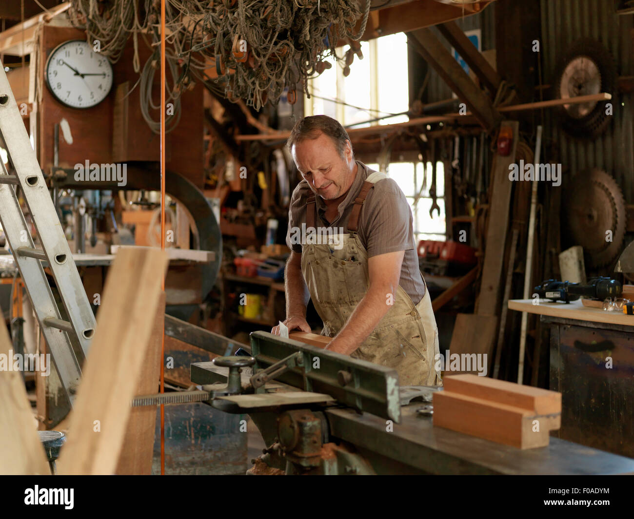 Boat builder in workshop Stock Photo