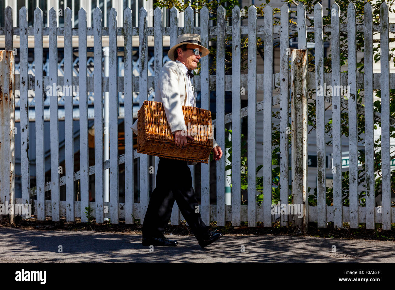 A Man Arrives At Lewes Train Station With His Picnic Basket To Watch The Opera At The Nearby