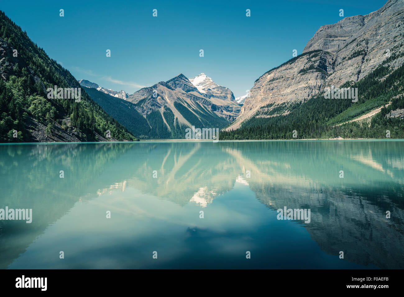 View of lake, forests and snow capped mountain, British Columbia, Canada Stock Photo