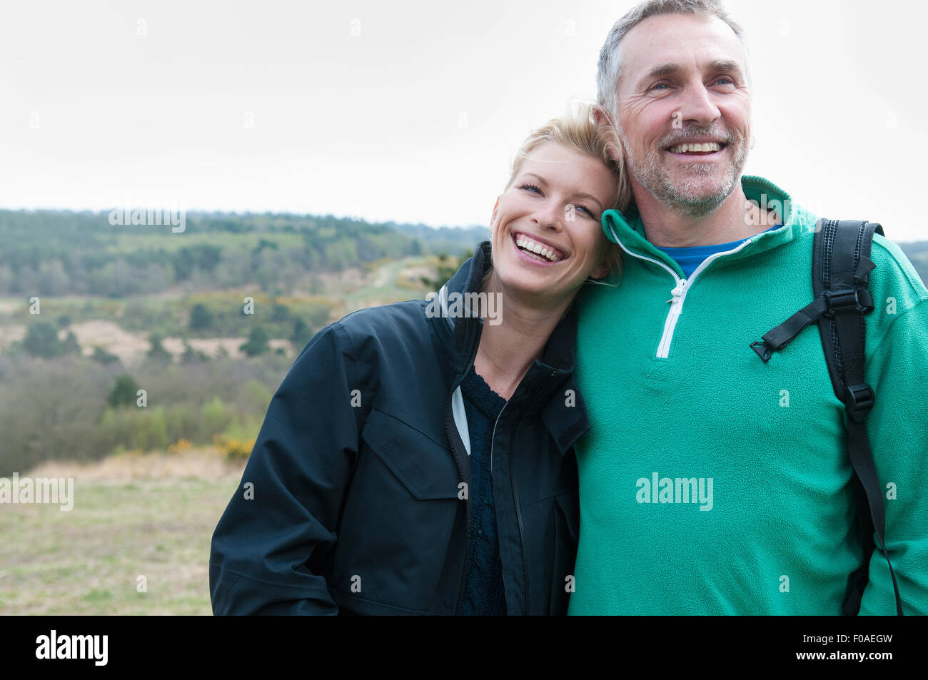 Hiking couple in rural landscape Stock Photo