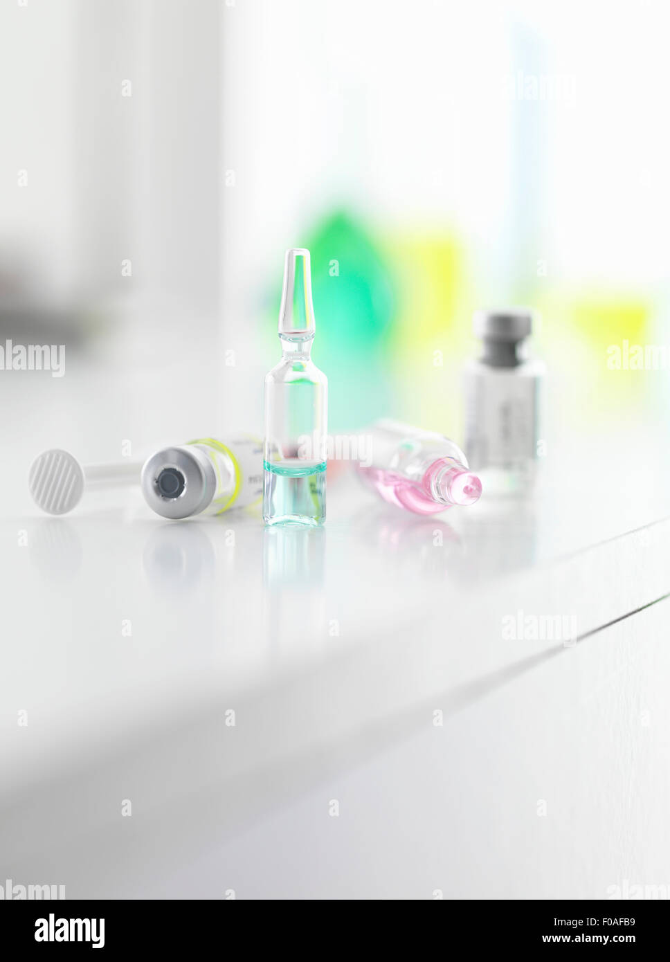 A variety of medicine and vaccines on a laboratory bench Stock Photo
