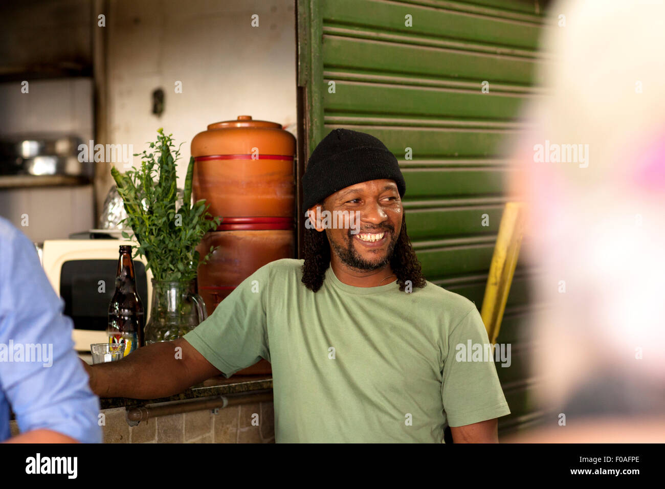 Man relaxing with beer in pub Stock Photo