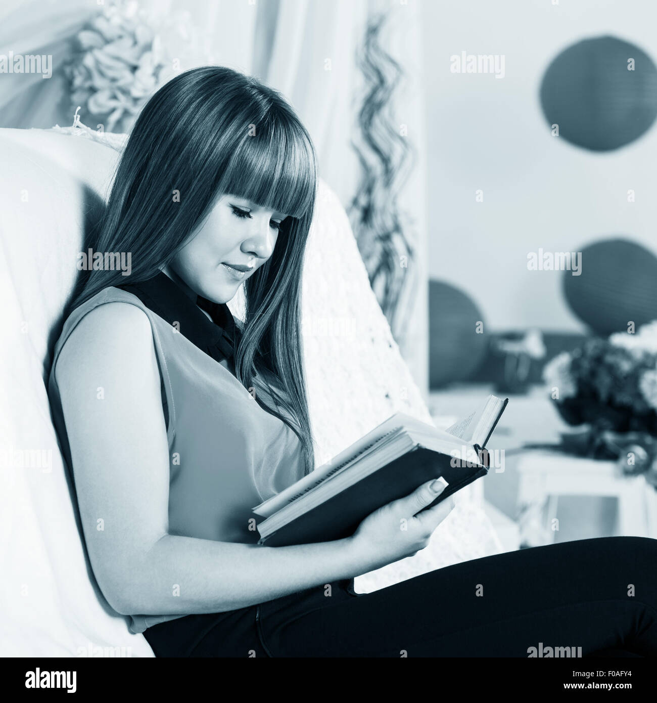 Beautiful little girl reading book Stock Photo