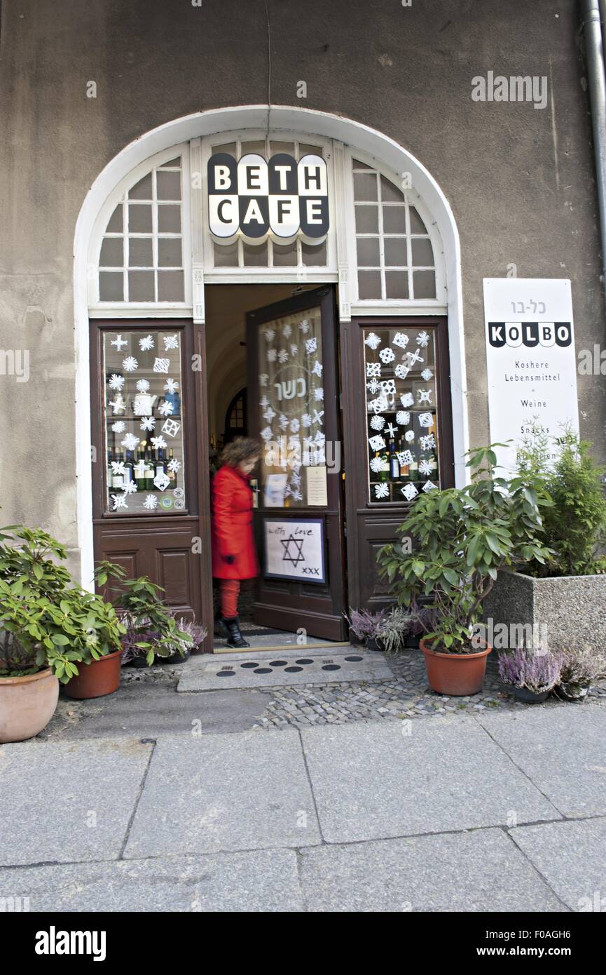 Woman coming out of Beth's cafe in Mitte, Berlin, Germany Stock Photo