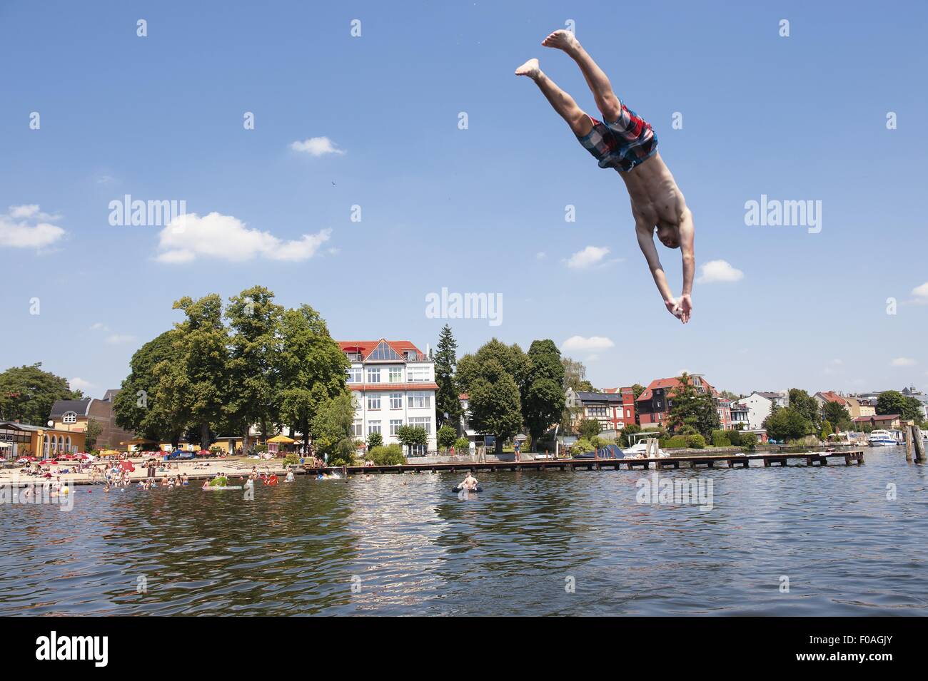 Man diving in Muggelsee lake in Berlin, Germany Stock Photo