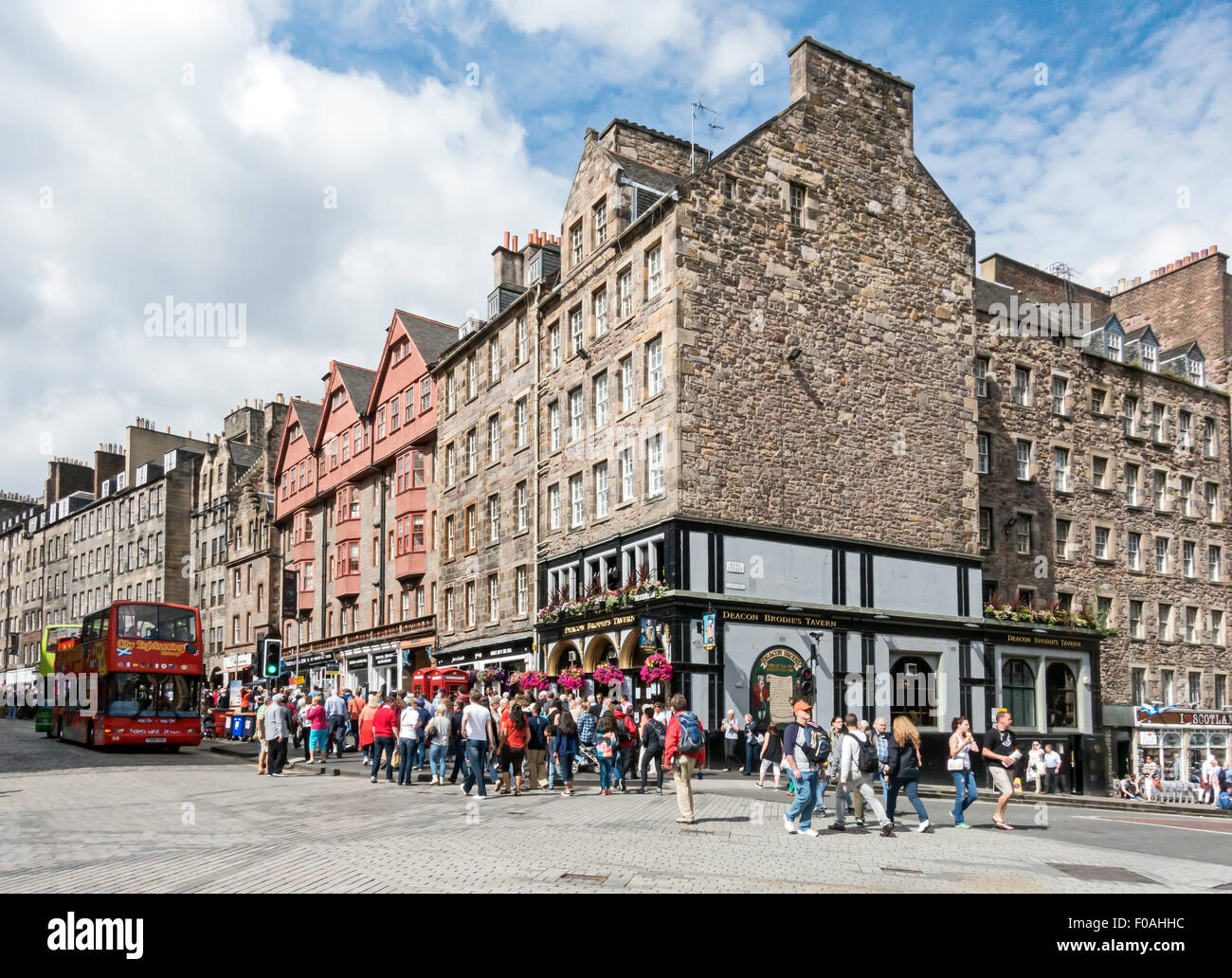 View up Lawnmarket in the Royal Mile Edinburgh Scotland with shops and