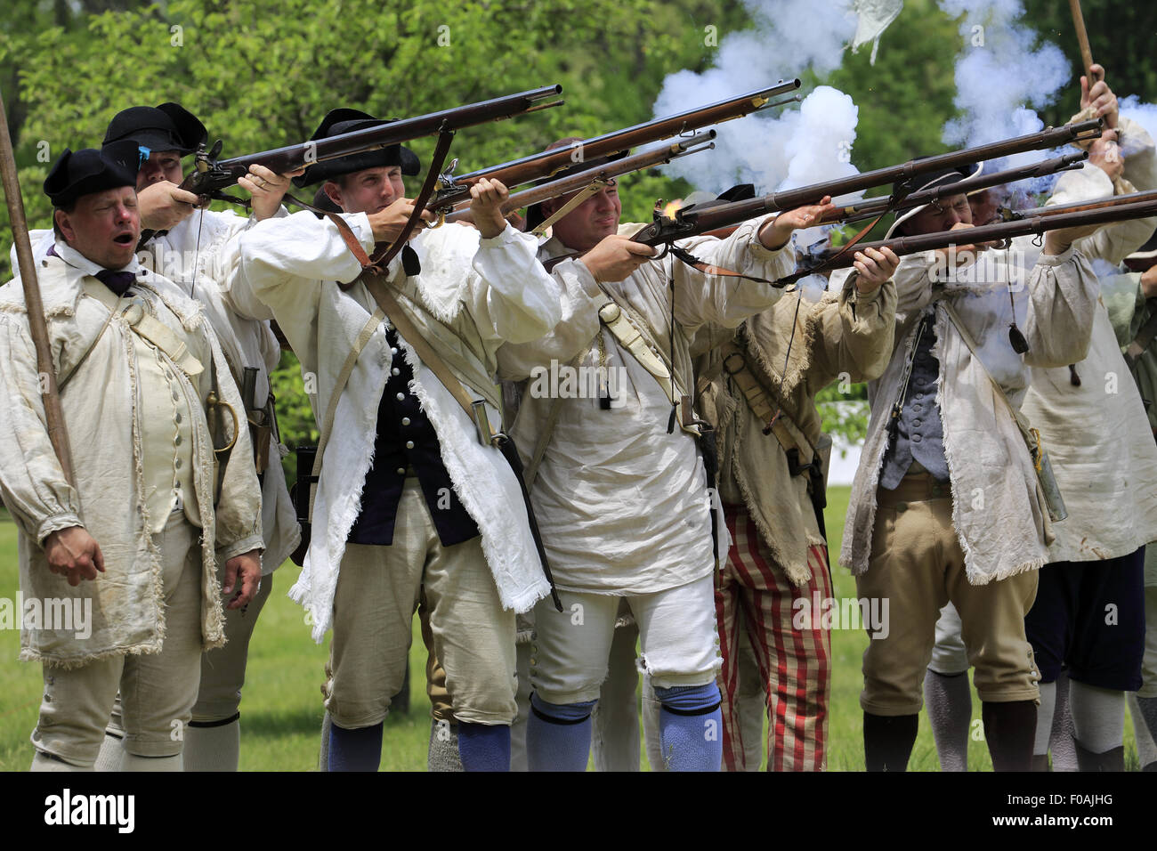 Musket firing at Revolutionary War reenactment at Jockey Hollow Encampment Weekend Morristown New Jersey USA Stock Photo