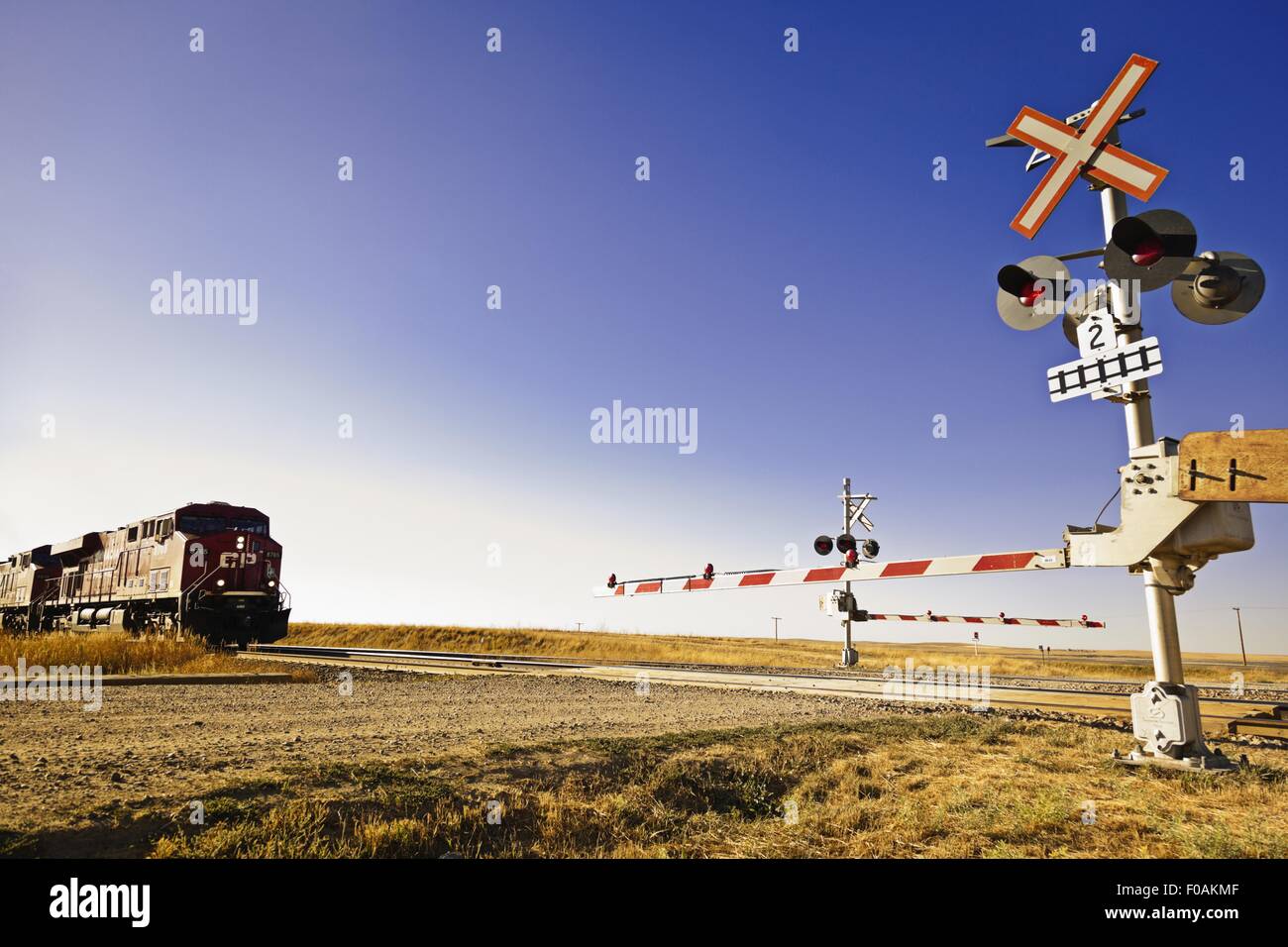 Railway crossing line at Highway 1 west to Alberta, Saskatchewan, Canada Stock Photo