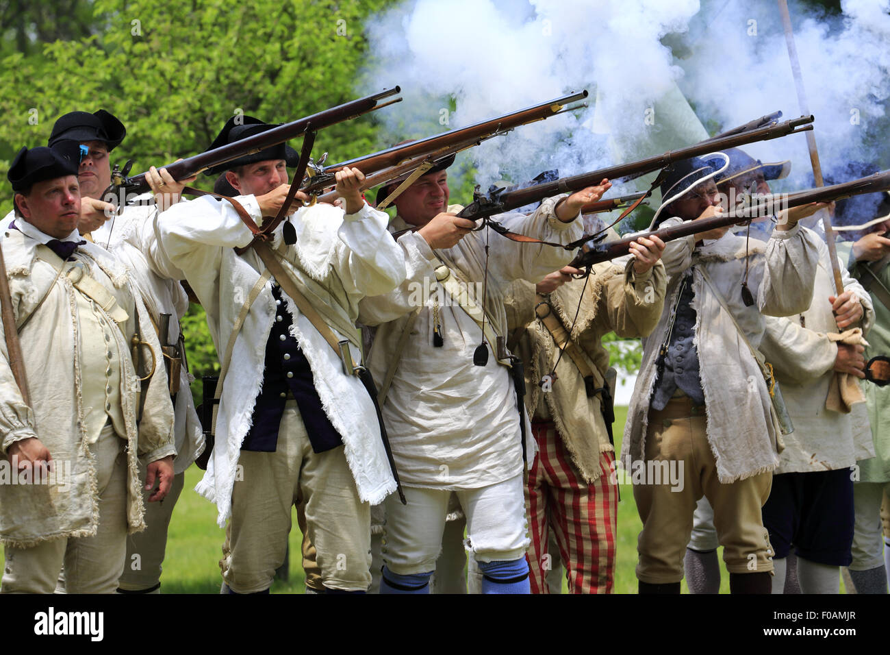 Musket firing at Revolutionary War reenactment at Jockey Hollow Encampment Weekend Morristown New Jersey USA Stock Photo