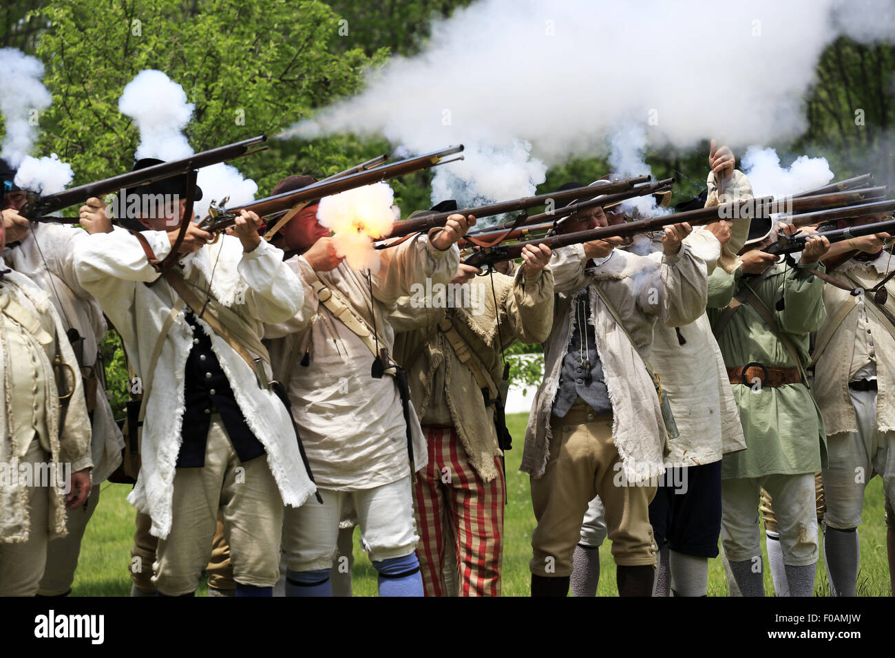 Musket firing at Revolutionary War reenactment at Jockey Hollow Encampment Weekend Morristown New Jersey USA Stock Photo