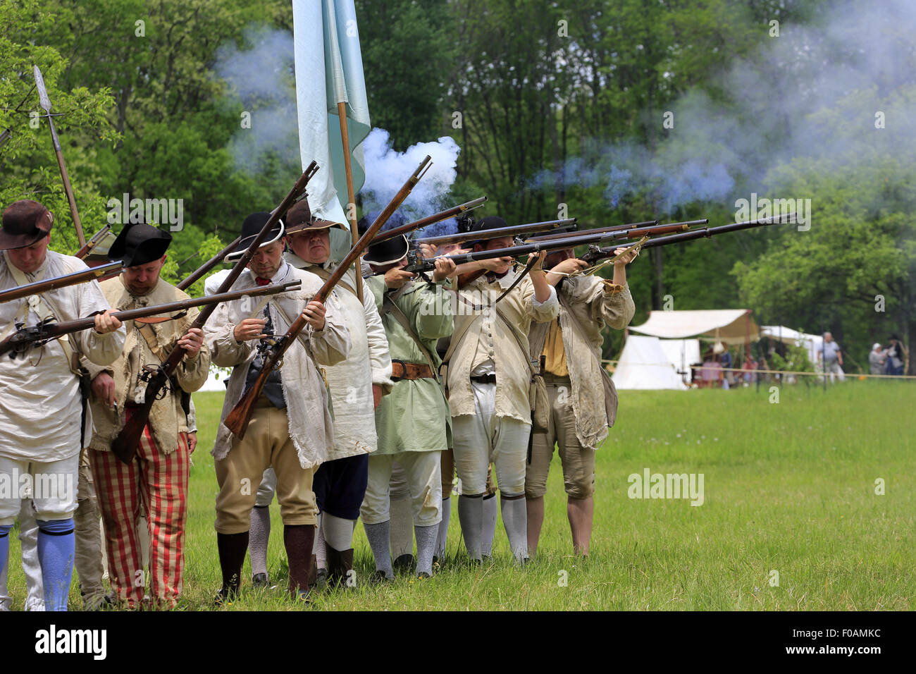 Musket firing at Revolutionary War reenactment at Jockey Hollow Encampment Weekend Morristown New Jersey USA Stock Photo