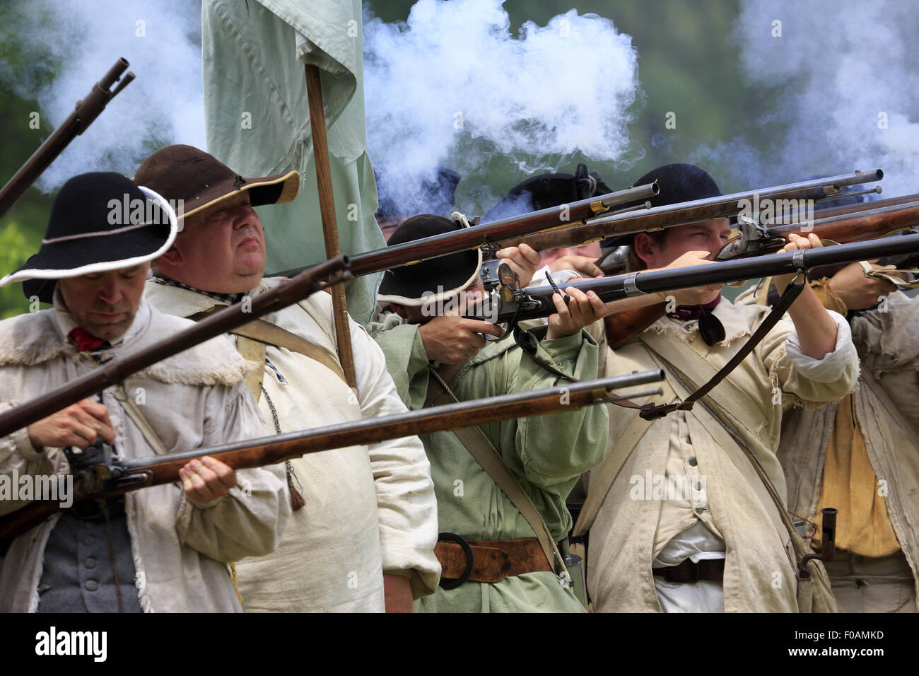 Musket firing at Revolutionary War reenactment at Jockey Hollow Encampment Weekend Morristown New Jersey USA Stock Photo