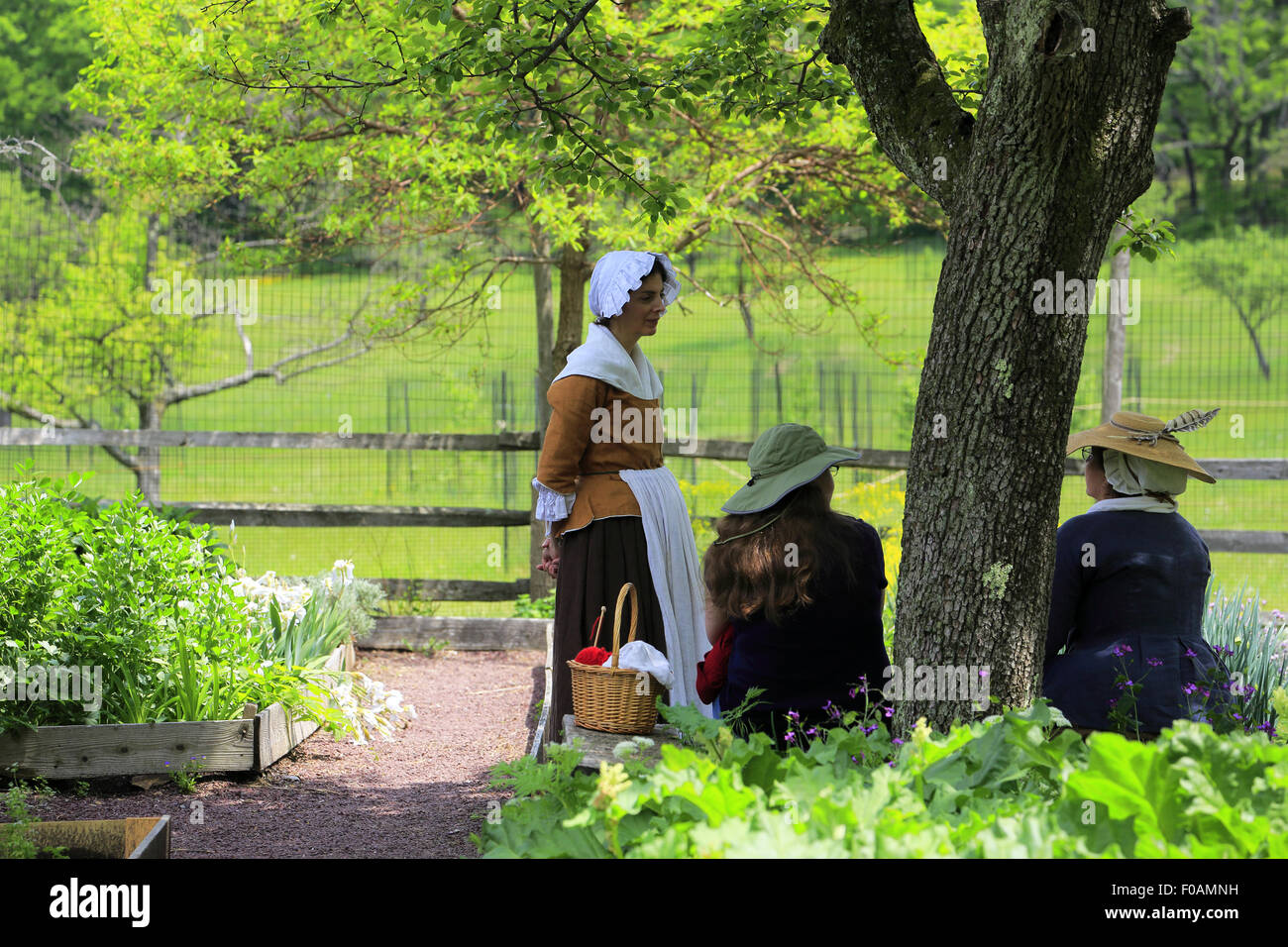 Historical reenactors in vegetable garden at Jockey Hollow Encampment during Revolutionary War Reenactment Morristown NJ USA Stock Photo