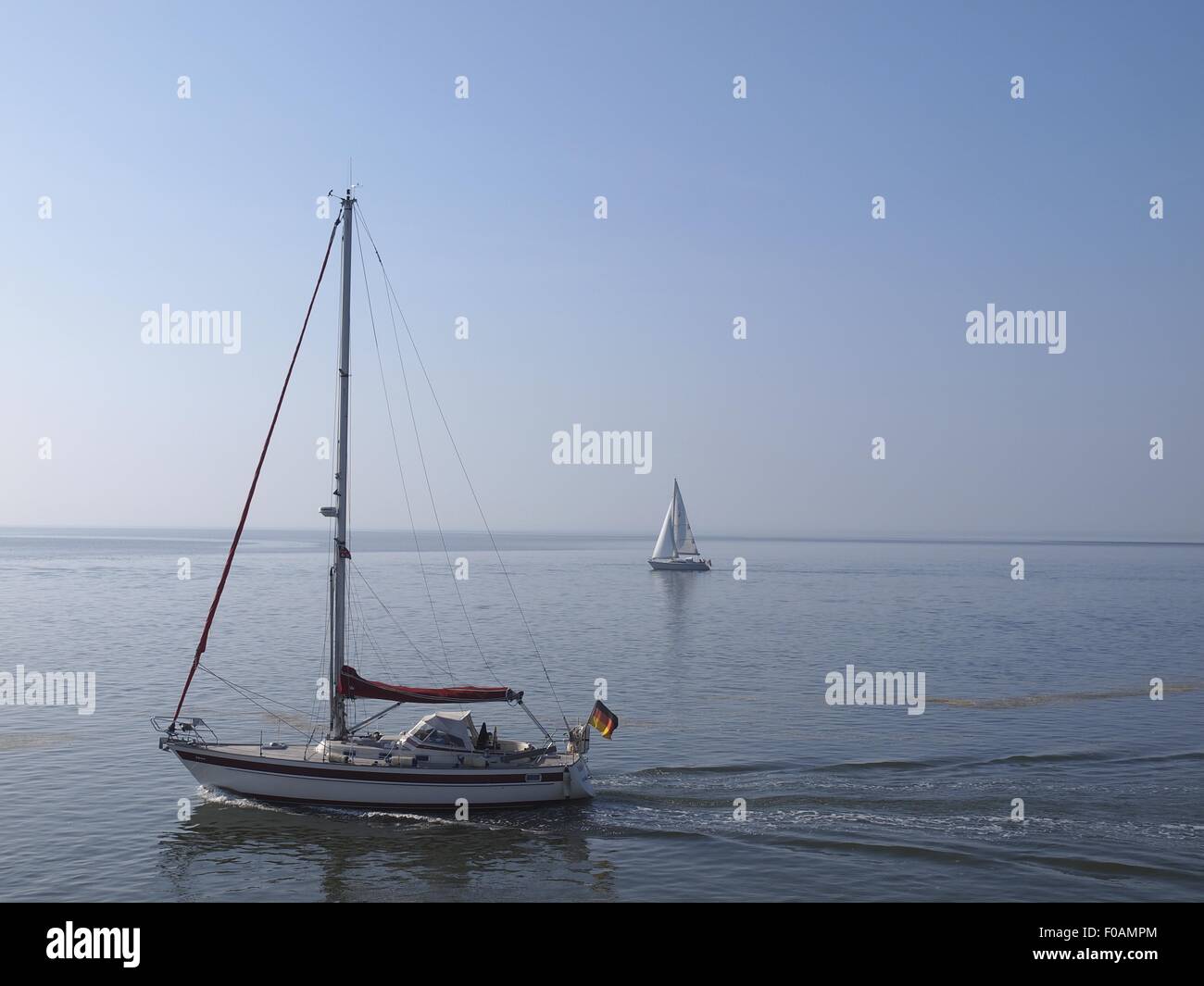 Sailboat in sea at Spiekeroog, Lower Saxony, Germany Stock Photo