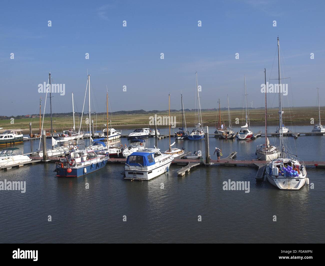View of moored boats at Port of Spiekeroog, Lower Saxony, Germany Stock Photo