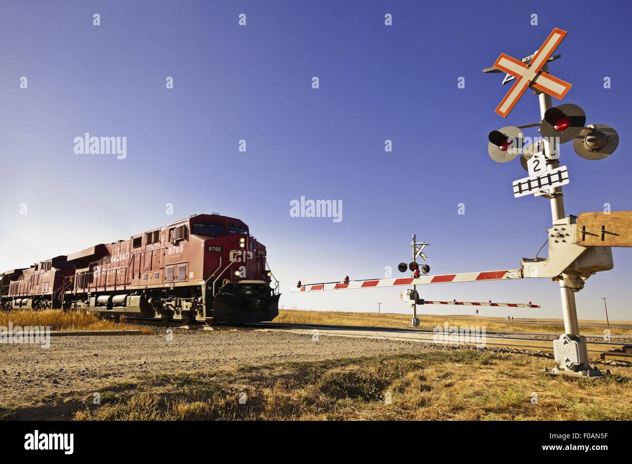 Railway crossing line at Highway 1 west to Alberta, Saskatchewan, Canada Stock Photo