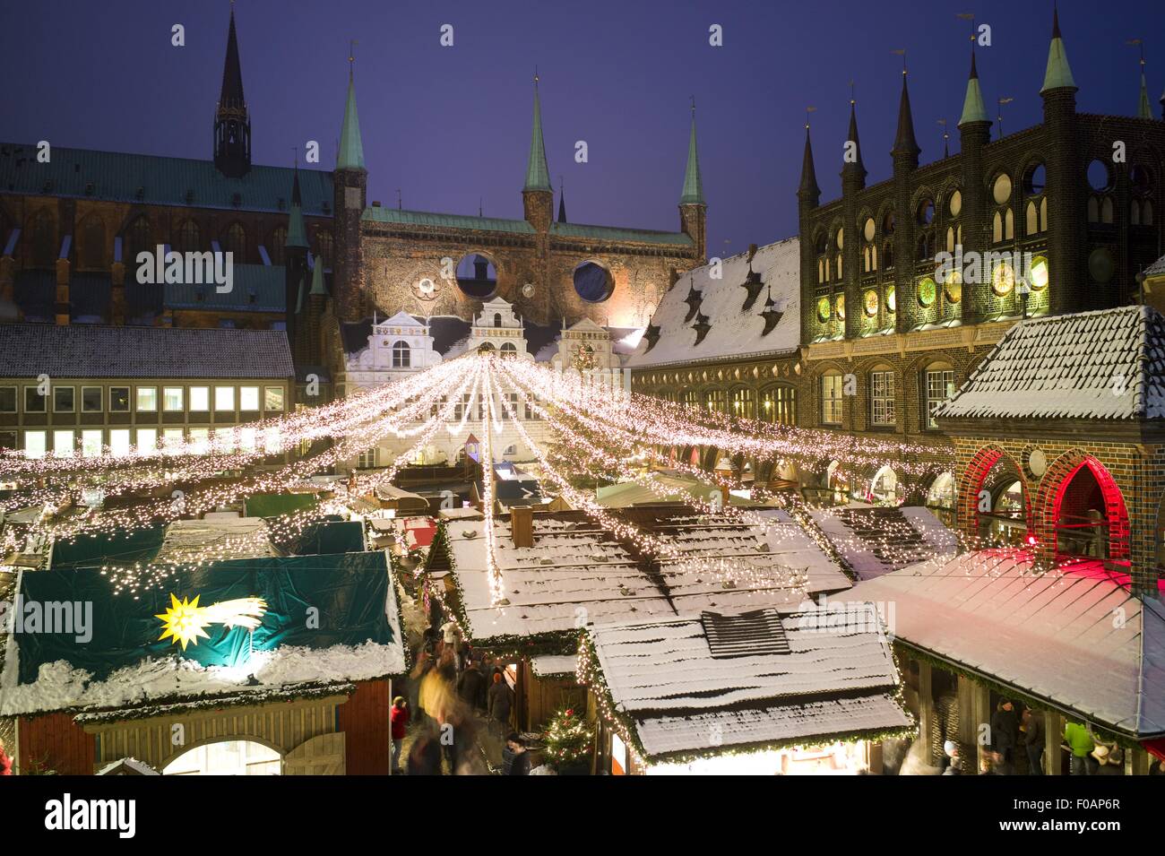 Lubeck Christmas market decorated with lights in front of Town Hall