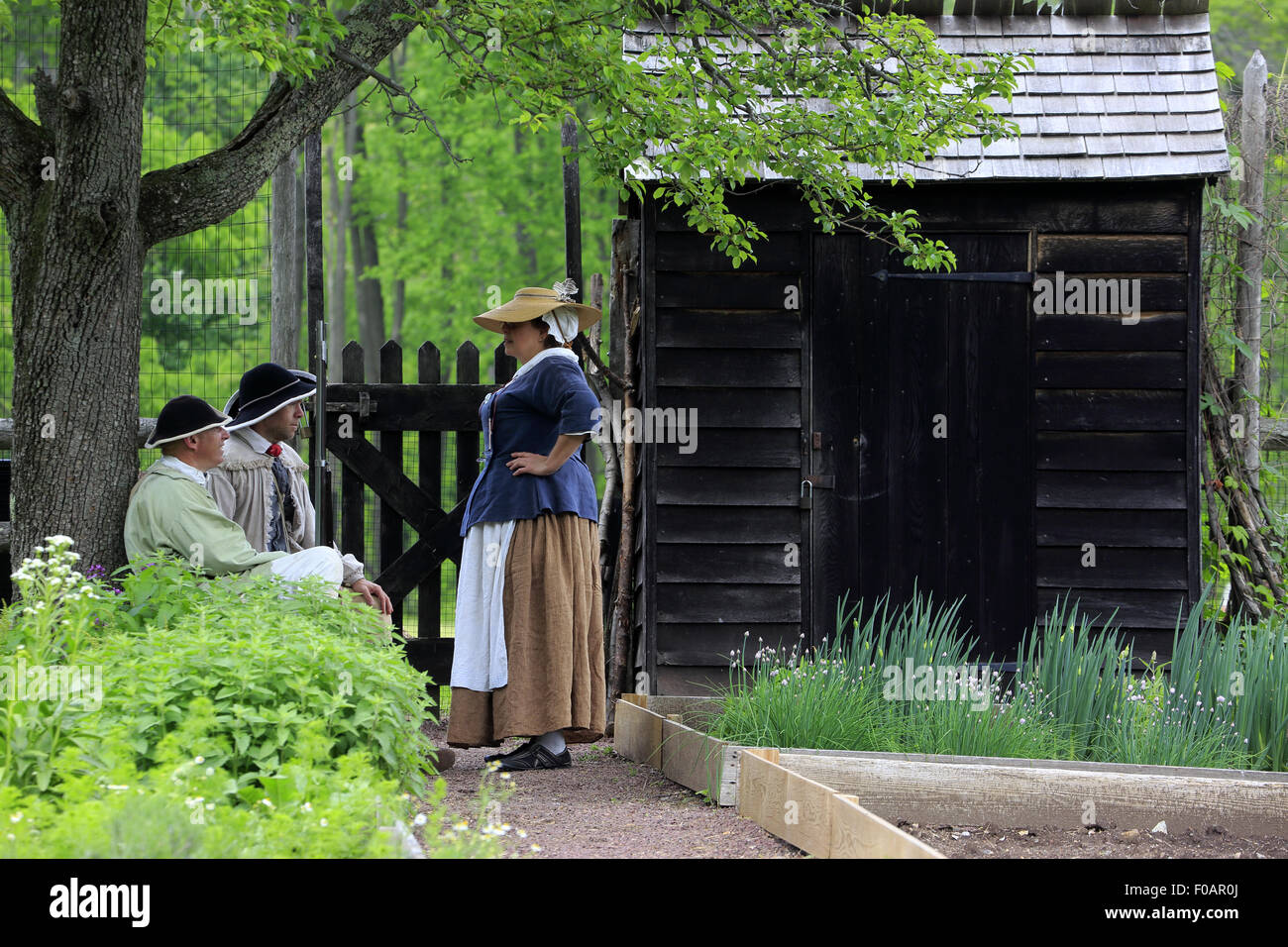 Historical reenactors in vegetable garden at Jockey Hollow Encampment during Revolutionary War Reenactment Morristown NJ USA Stock Photo