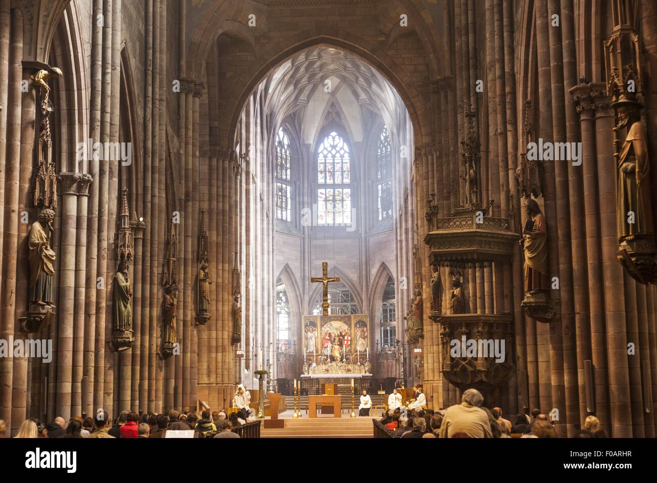 Figures of apostles to praying in Munster of Freiburg, Germany Stock