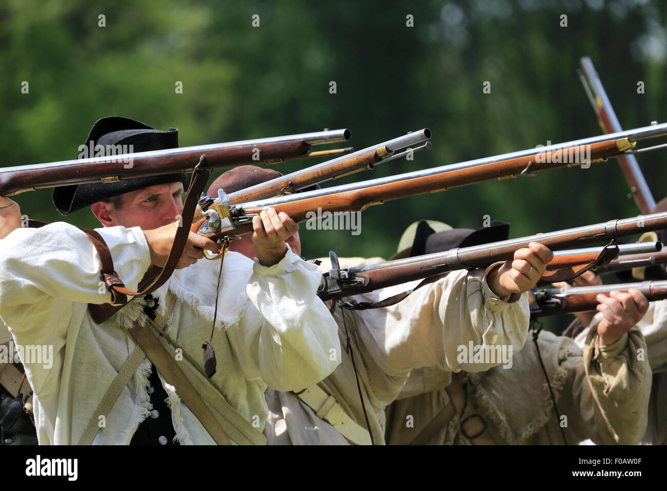 Continental Army soldiers firing muskets during Revolutionary War reenactment at Jockey Hollow in Morristown National Historical Park,New Jersey, USA Stock Photo