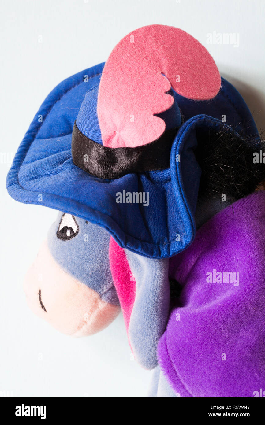 Musketeer Eeyore soft cuddly toy from Winnie the Pooh set on white background Stock Photo