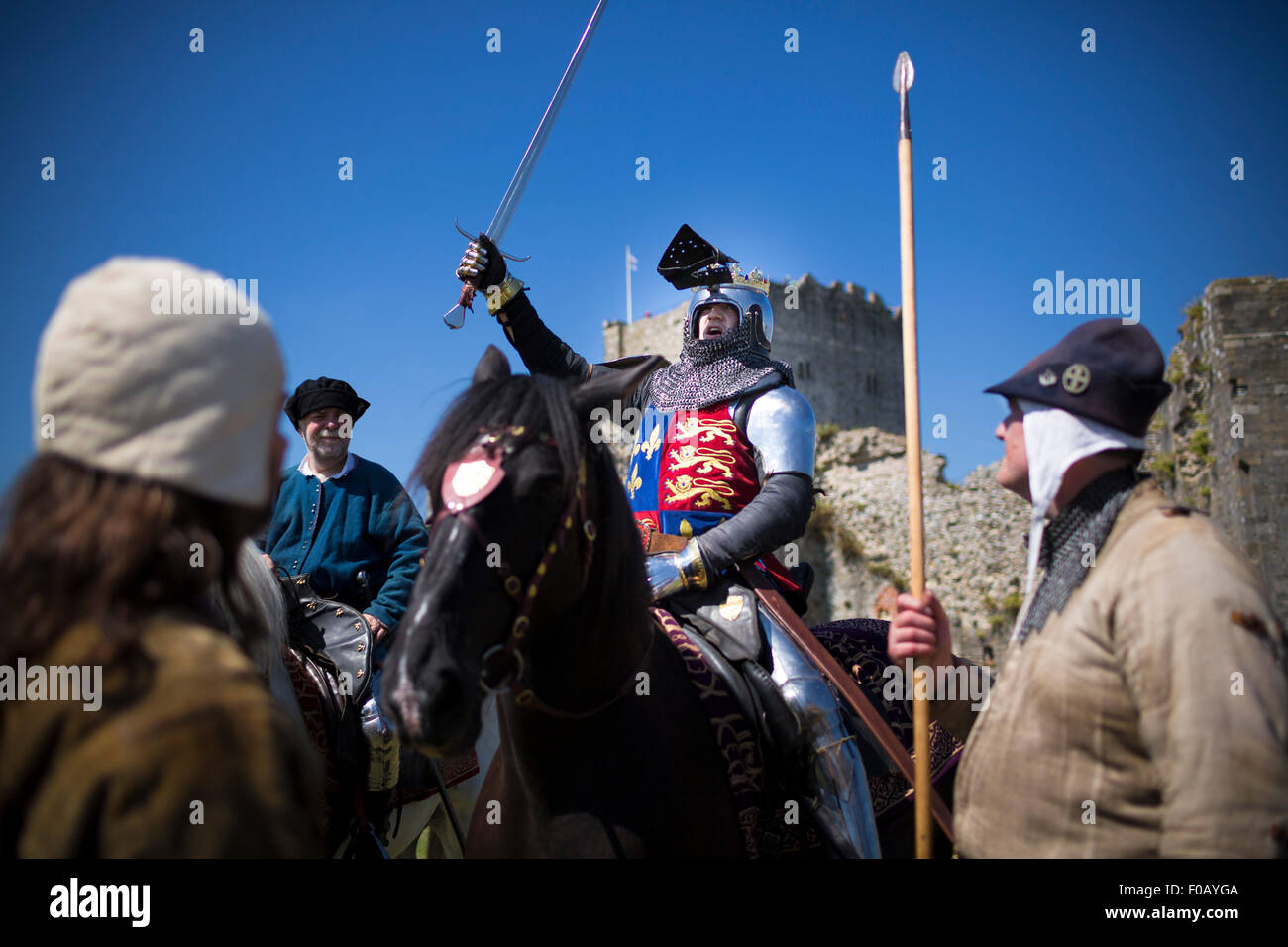 King Henry V rouses his men at Portchester Castle in Hampshire as his troops prepare to sail to France do battle at Agincourt.   Stock Photo