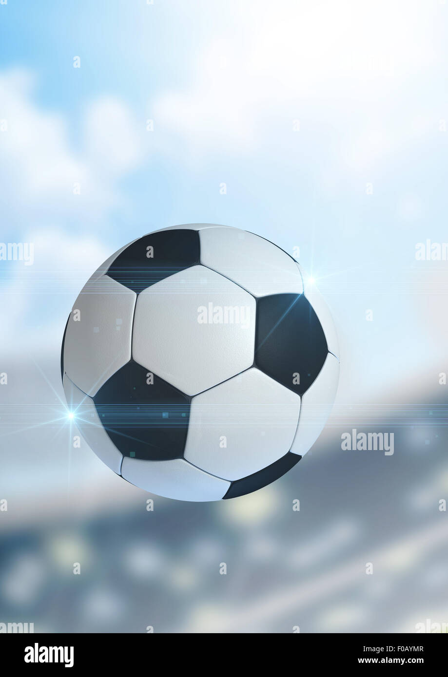 A regular soccer ball flying through the air on a stadium background