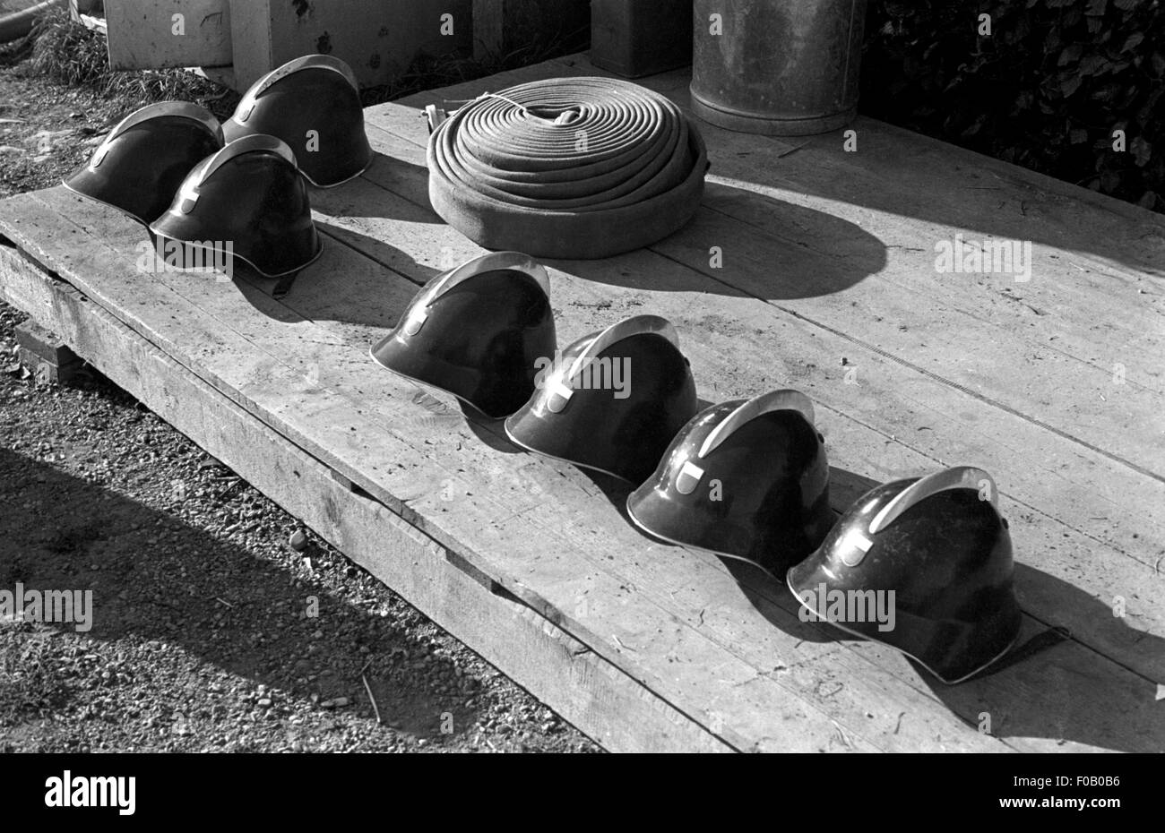 Firefighter's helmets and hose Stock Photo