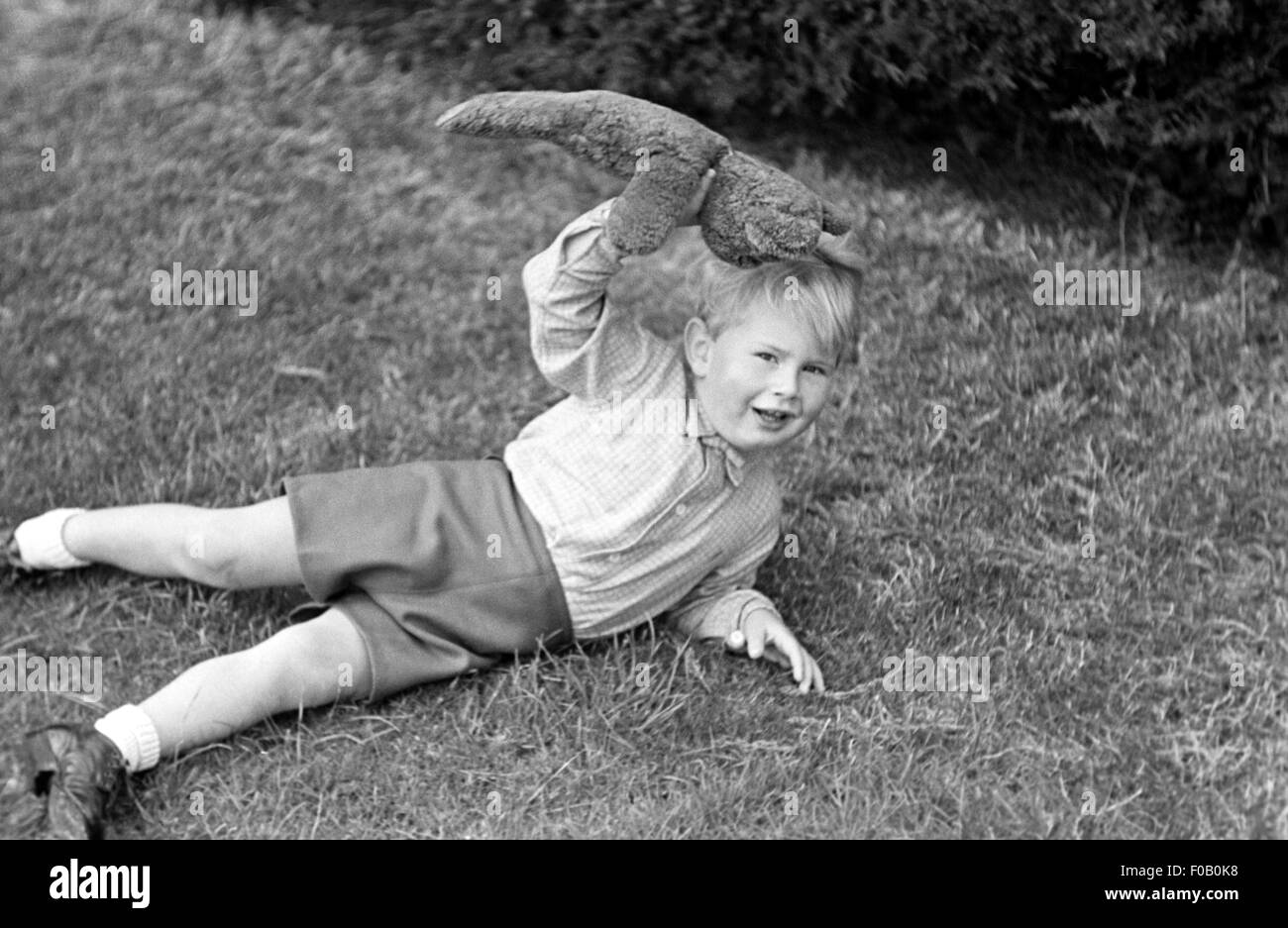 A young boy with his teddy bear Stock Photo