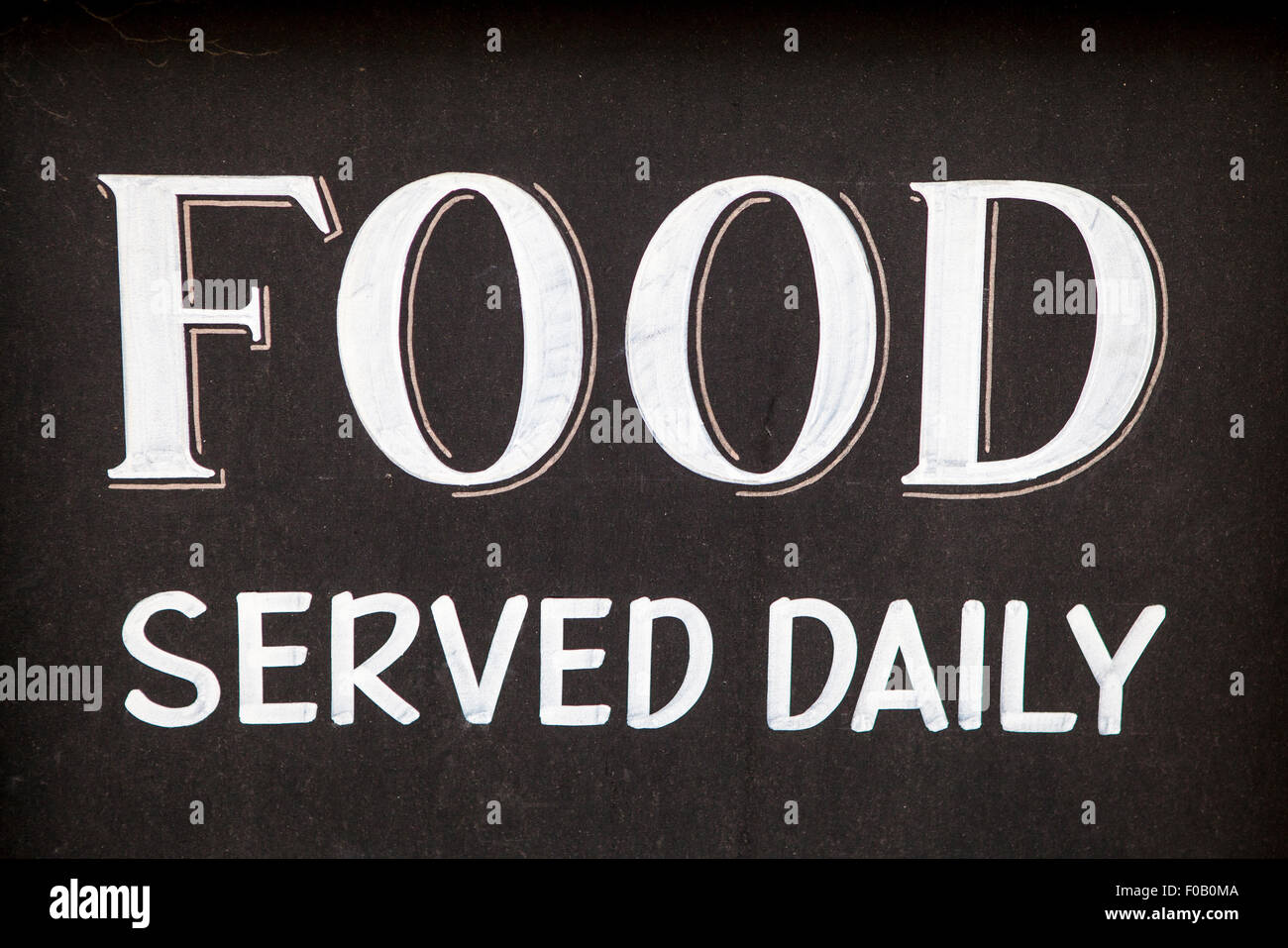 A ‘Food Served Daily’ sign. Stock Photo