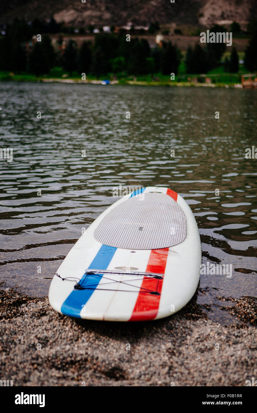 A standup paddle board on a lake. Stock Photo