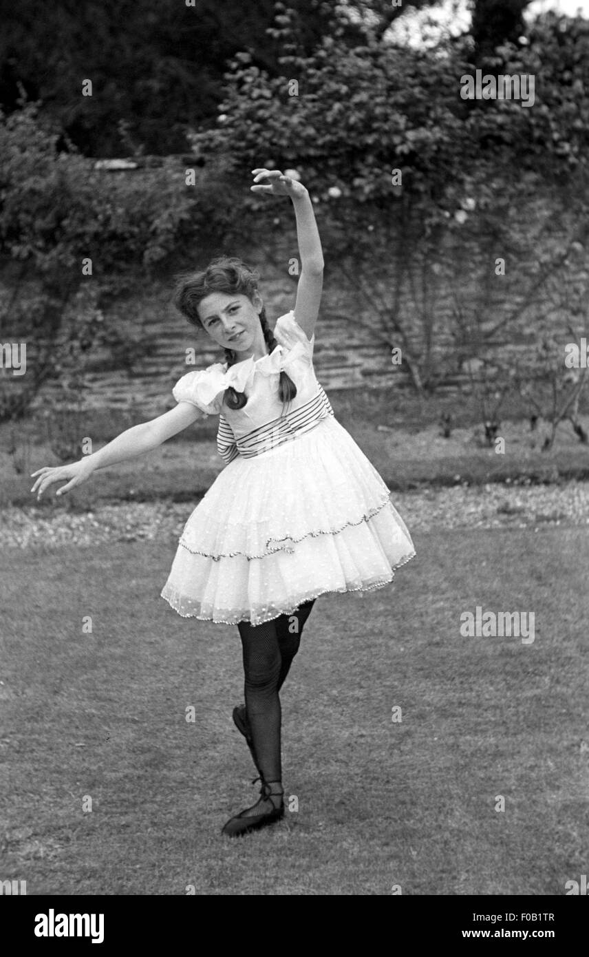 A young woman dancing in a garden Stock Photo - Alamy