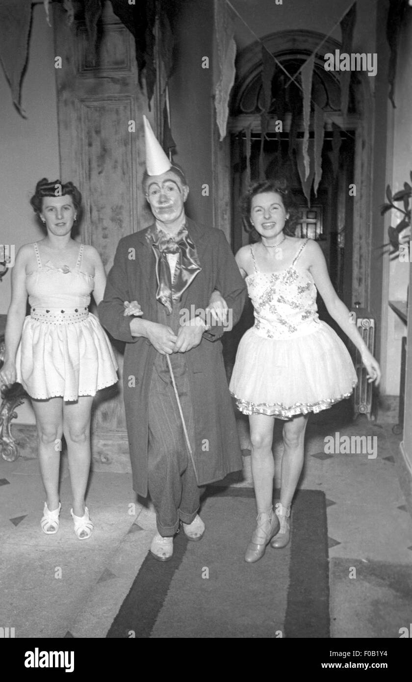 Three people wearing fancy dress Stock Photo