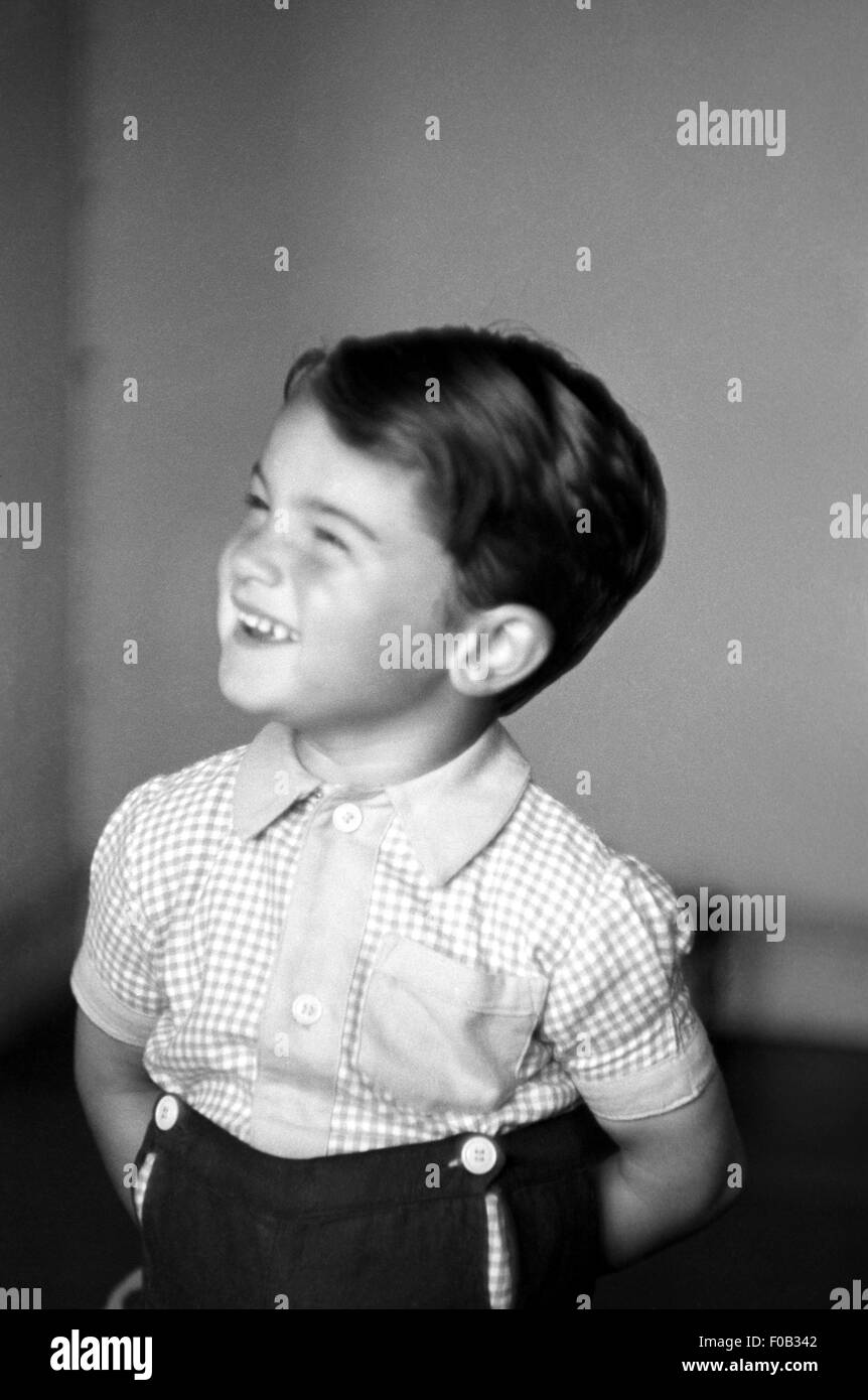 A smartly dressed child smiling and laughing Stock Photo
