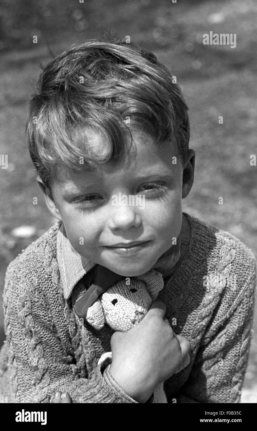 A young boy with his teddy bear Stock Photo - Alamy