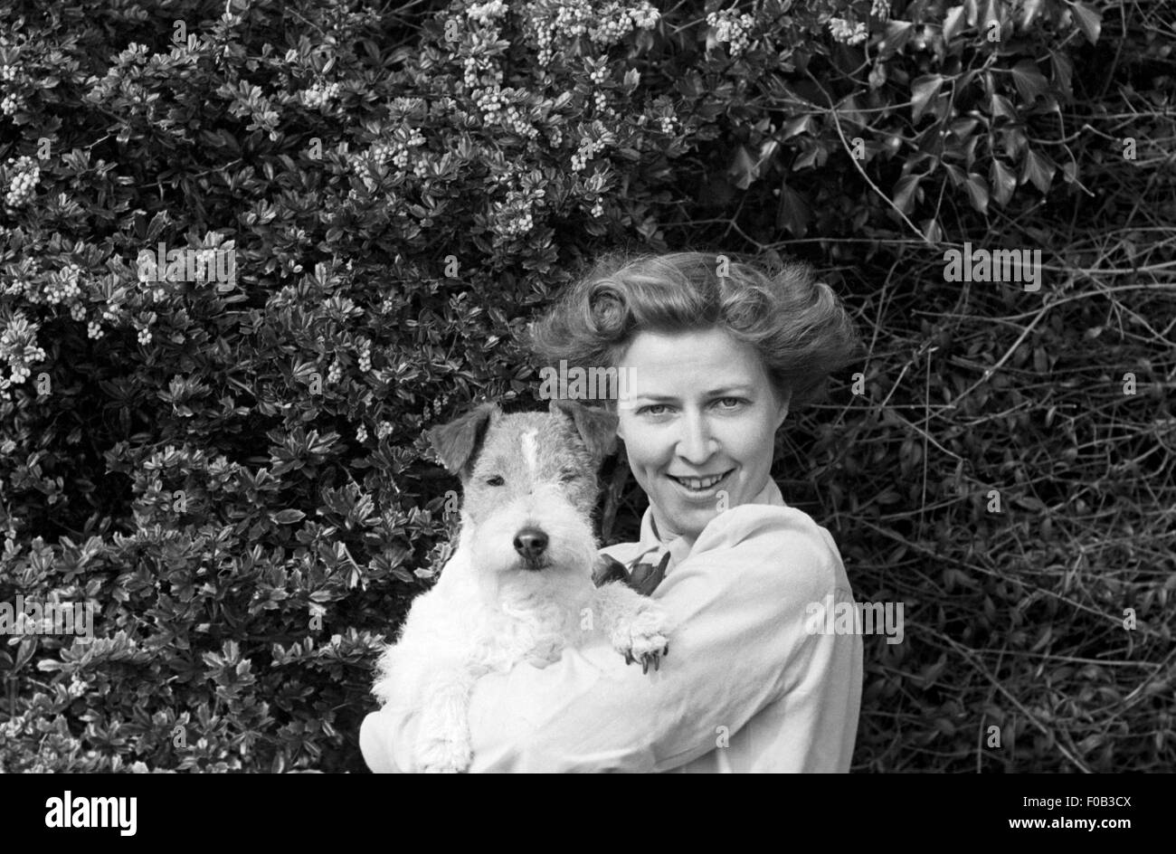 Portrait of a woman with her dog Stock Photo - Alamy