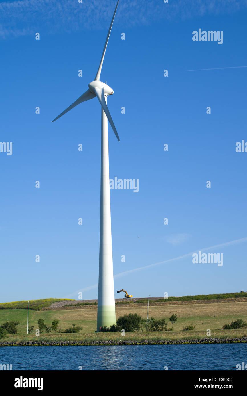 Large wind turbine at side of North sea canal Holland Stock Photo