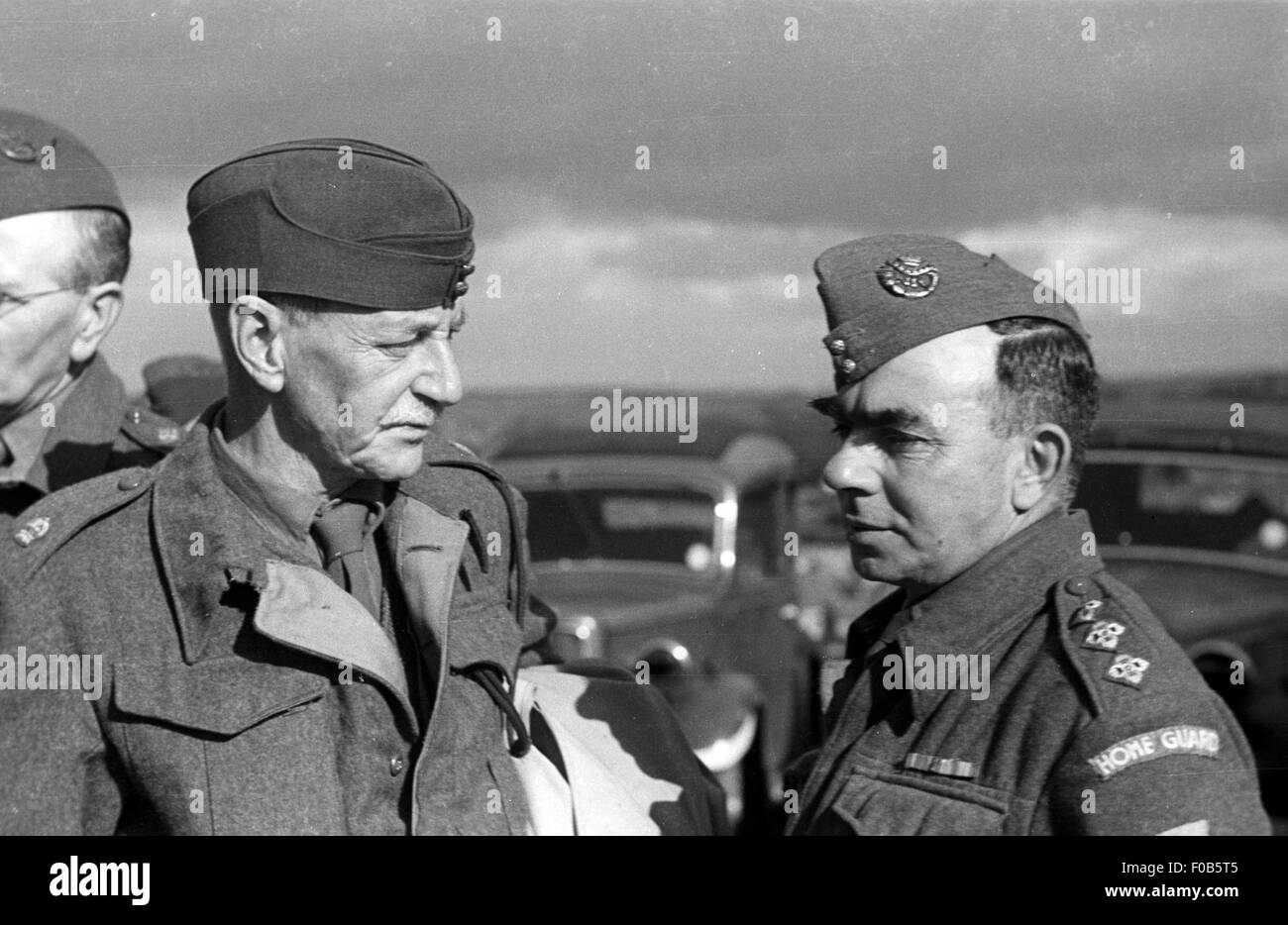 Two men of the Home Guard in uniform in discussion Stock Photo