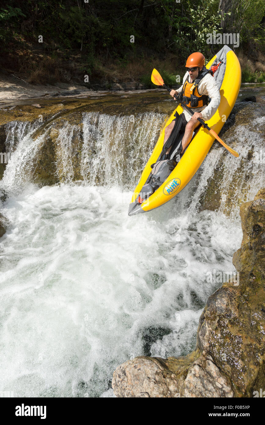 Paddling an inflatable kayak down a waterfall, Fall Creek, Oregon Stock