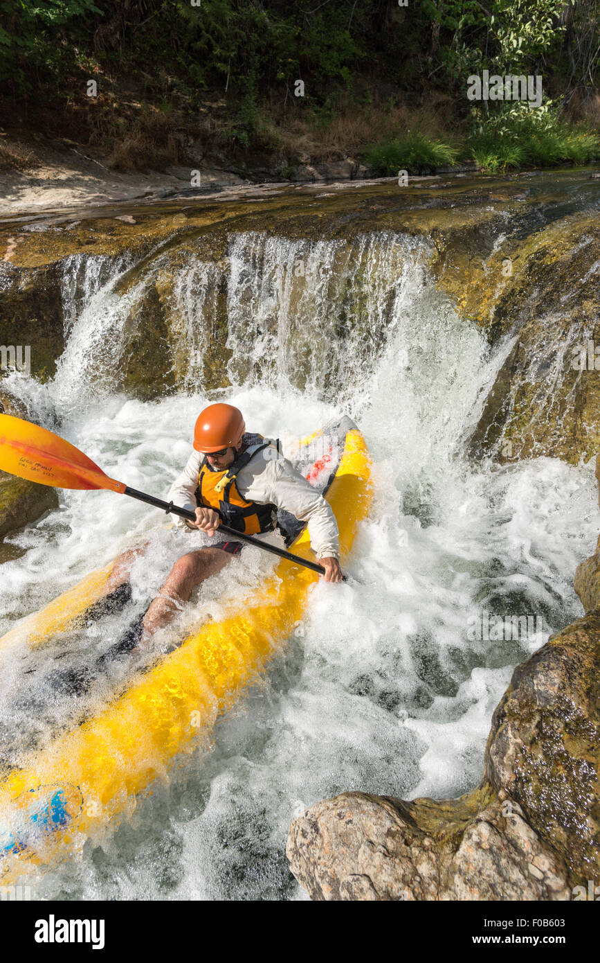 Paddling an inflatable kayak down a waterfall, Fall Creek, Oregon Stock