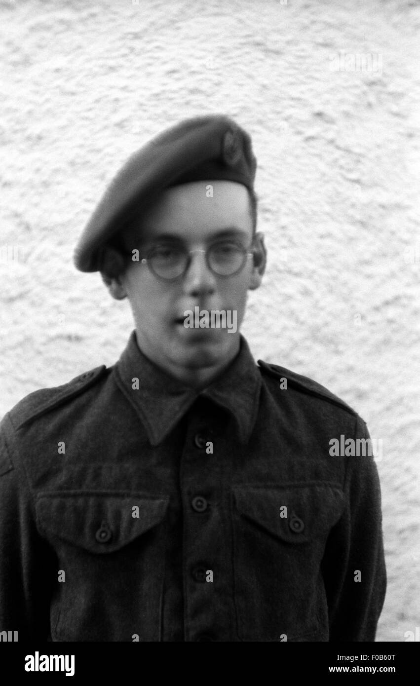 A young man wearing his army cadet uniform and glasses. Stock Photo